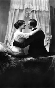 Couple, lovers flirting on a sofa, c