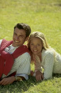 Couple lying on the green meadow