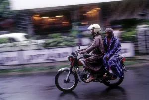 A couple riding motorcycle on a rainy day at Ernakulam