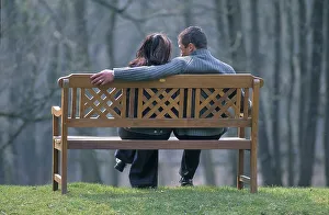 Couple sitting on park bench