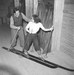 Couple skiing together in the 1940s