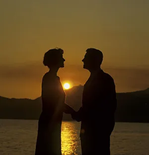 Couple in sunset, encounter, opposite