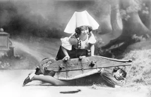 Couple, theater, overturned wheelbarrow