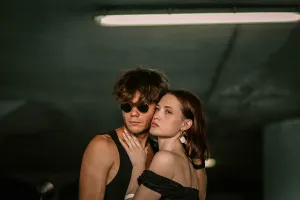 A couple, with one wearing sunglasses