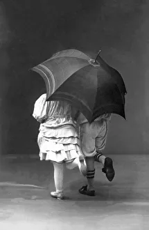 Couples, flirt, two children as a couple under an umbrella