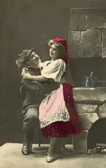 Couples, flirt, man and woman in national costumes hug each other in the kitchen