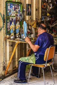 Craftsmen making statues of saints