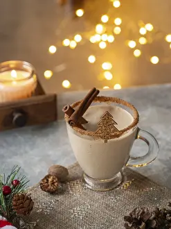 Creamy christmas eggnog featuring cinnamon sticks