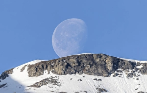Category Mountain Landscapes Prints: Crescent moon rises over mountain