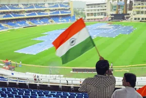 Category Historic EN Prints: Cricket fans wave Indian flag at D Y Patil cricket stadium