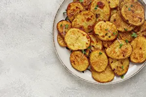 Crispy potato slices, with parmesan cheese and spices