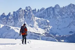 Cross country skier decending from Uribrutto through the Passo Valles
