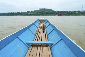 Crossing Mekong river by boat in Luang Prabang