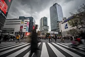 Crowd crossing zebra crossing on a large intersection
