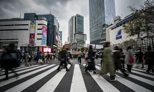 Crowd crossing zebra crossing on a large intersection