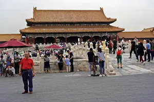 Framed Print : Crowds explore a historic temple complex with richly decorated architecture Framed Print : Crowds explore a historic temple complex with richly decorated architecture