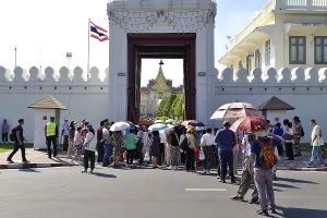 Crowds of tourists push through the entrance gate