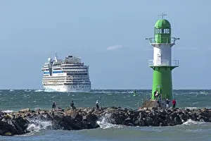 Cruise ship AIDA nova leaving, lighthouse
