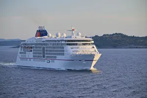 A cruise ship Europa 2 sails through the calm sea