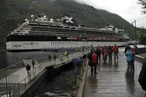 There is a cruise ship in the Geiranger Fjord