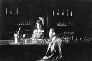 Customer sitting at the bar, historic photograph