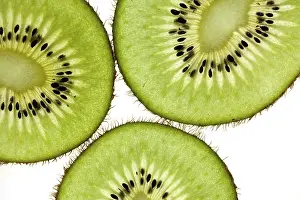 Cut kiwi against a white background Studio shot