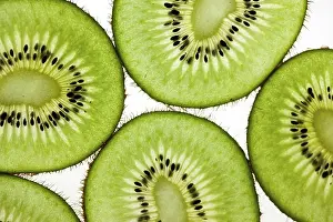Cut kiwi against a white background Studio shot