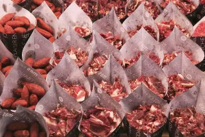 Cuts of ham and small sausages packed for sale