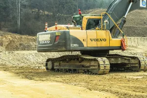 Daejeon, South Korea. March 3, 2019: Backhoe sitting idle at construction site in mountainous area
