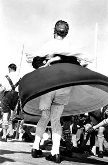 Dance in Bavarian traditional costume with view under the skirt