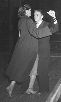 Dancing in the 1940s. A couple at a dance holding each other close