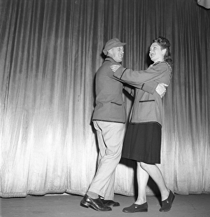 Dancing in the 1940s. A couple in full figure pictured when dancing