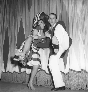 Dancing in the 1940s. A couple in full figure pictured when dancing Hokey Cokey