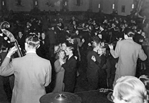 Dancing in the 1940s. The dance floor is filled with dancing couples moving to the band and he music. Picture taken at Nalen in Stockholm Sweden in the 1940s