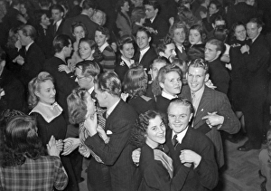 Dancing in the 1940s. The dance floor is filled with dancing couples moving to the music