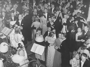 Dancing in the 1940s. The dance floor is filled with well dressed dancing couples