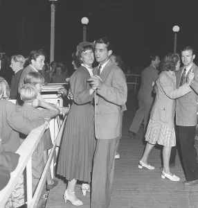 Dancing in the 1940s. A young couple at a dance holding each other close