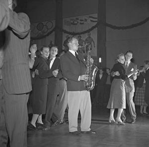 Dancing in the 1950s. The dance floor is filled with dancing couples moving to the music