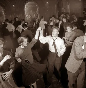 Dancing in the 1950s. The dance floor is filled with dancing couples moving to the music