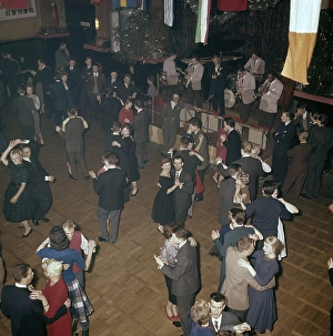 Dancing in the 1950s. The dance floor is filled with well dressed dancing couples