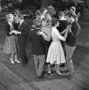 Dancing in the 1950s. A nice outdoor summer dance event where young couples are dancing and having fun