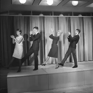 Dancing in the 1960s. The dance Hully Gully is being made popular and here are men and women dancing the new craze
