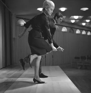 Dancing in the 1960s. The dance Hully Gully is being made popular and here are men and women dancing the new craze