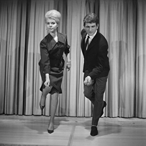 Dancing in the 1960s. The dance Hully Gully is being made popular and here are men and women dancing the new craze