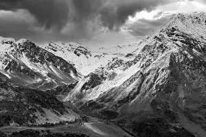 Dark clouds over the snow-covered mountains