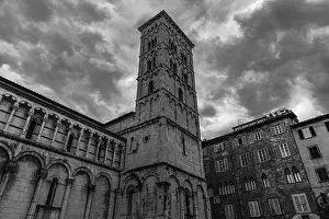 Dark rain clouds over the bell tower of the church of San Michele in Foro