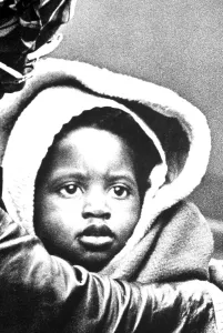Dark skinned child with sad look