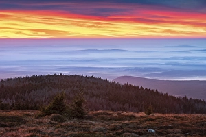 Dawn on the Brocken, view over hills and forests with valley fog