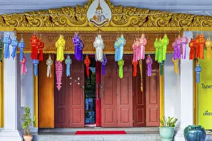 Decorated entrance to Wat Yannawa Buddhist temple decorated with colored lanterns