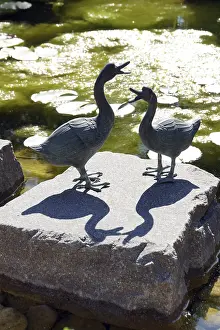 Decoration with two ducks at the garden pond